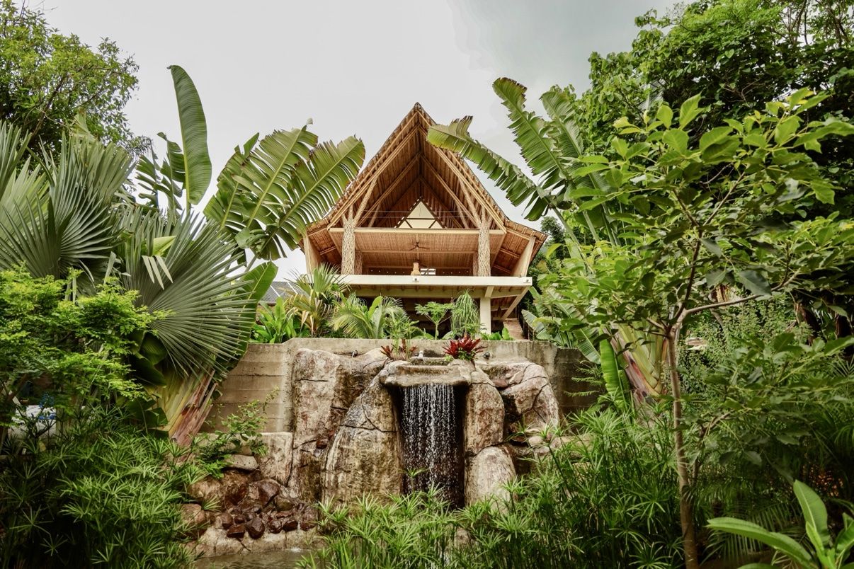 The lodge and waterfall surrounded by jungle